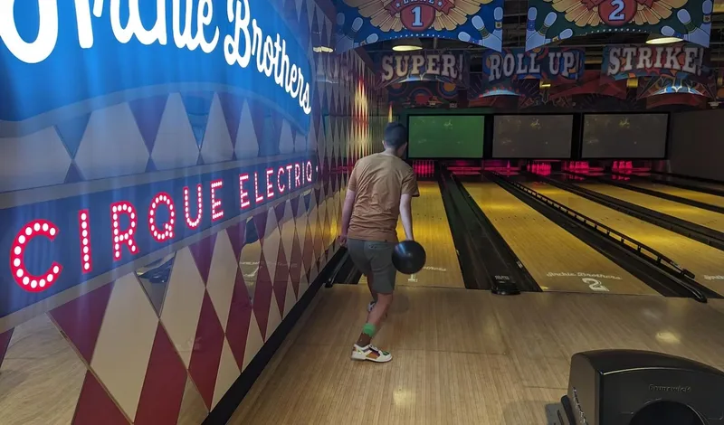 A participant tenpin bowling