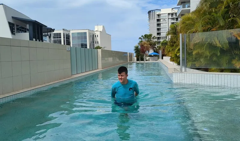 A participant swimming at the pool